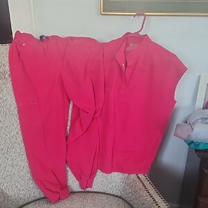 Figs V-Neck Scrub Top in Bright Pink With Jogger Pants To Complete The Scrub Set